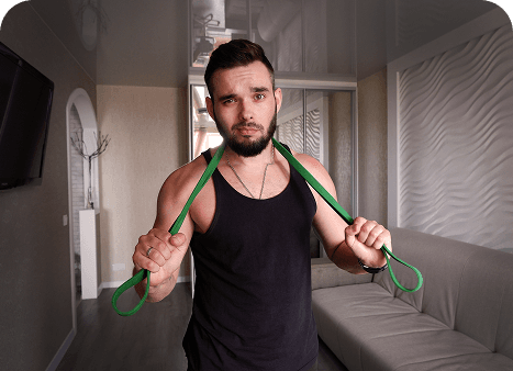 Someone training at home with a resistance band