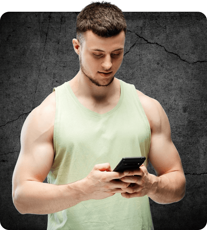 Someone in a gym vest reading a message on their phone